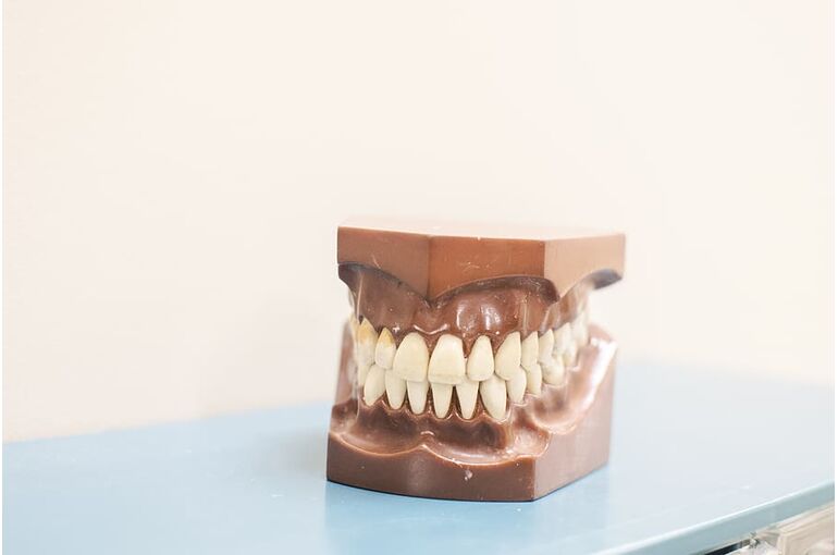 teeth-denture-on-top-of-blue-shelf